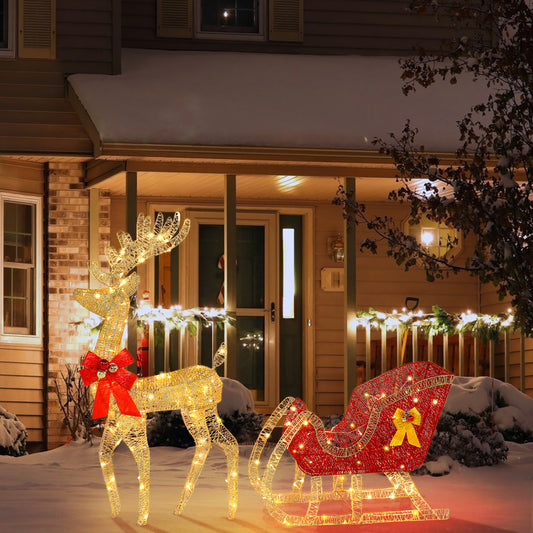 Decorative LED reindeer and sleigh on a porch with Christmas lights.